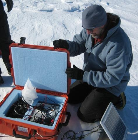 Dr. Phillip Kyle installs a sensing device on Mt. Erebus